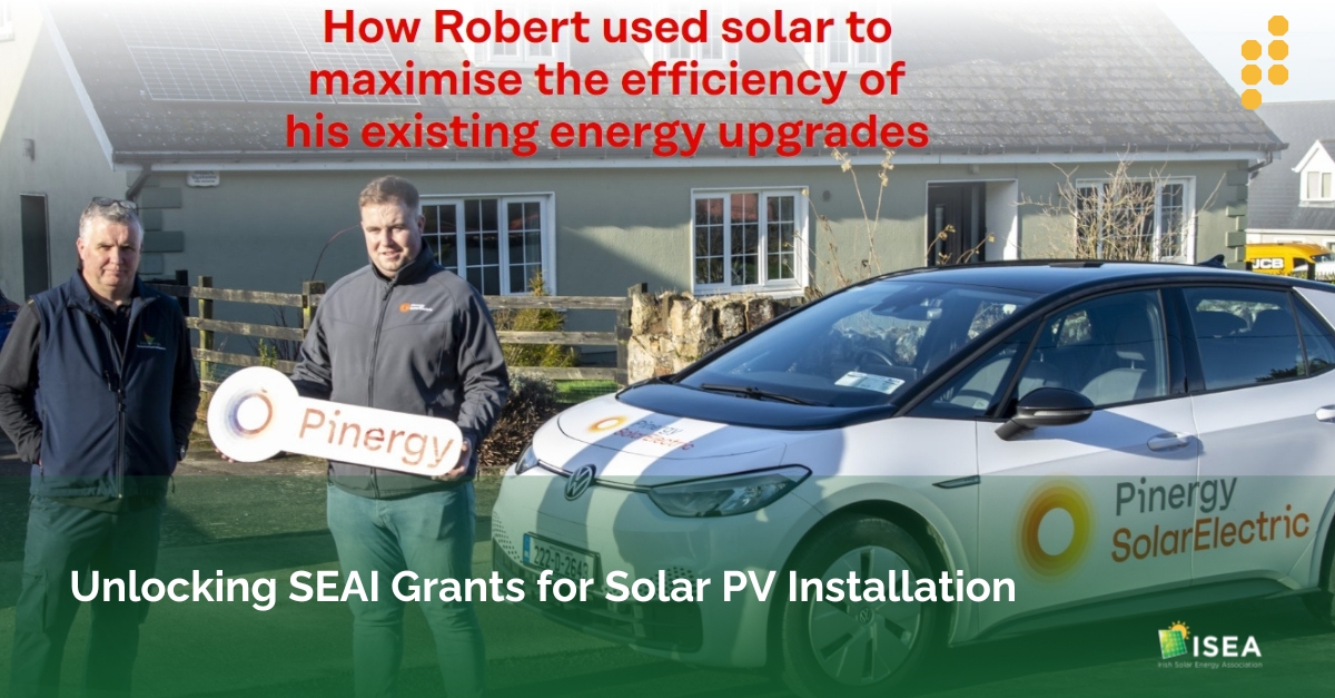 Homeowner holding a Pinergy sign after solar panel installation